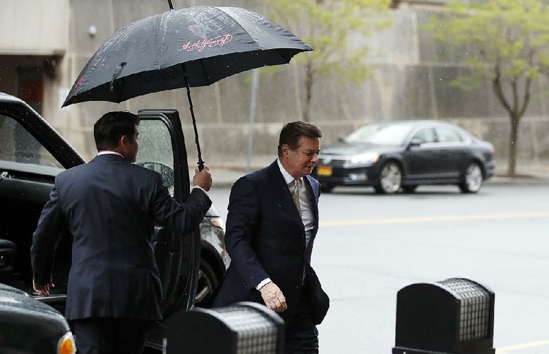 Paul Manafort (right) was interviewed by the FBI in 2013 and 2014, years before becoming President Donald Trump’s campaign adviser, according to documents released this week.  