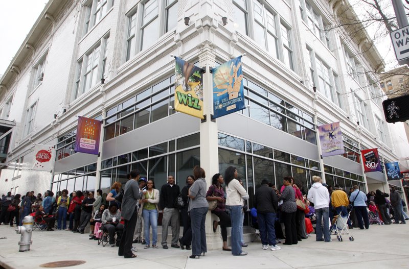 FILE — People line up around the block in front of The Rep in downtown Little Rock for the theater's "Pay What You Can Night" for the production of "The Wiz" in 2012.