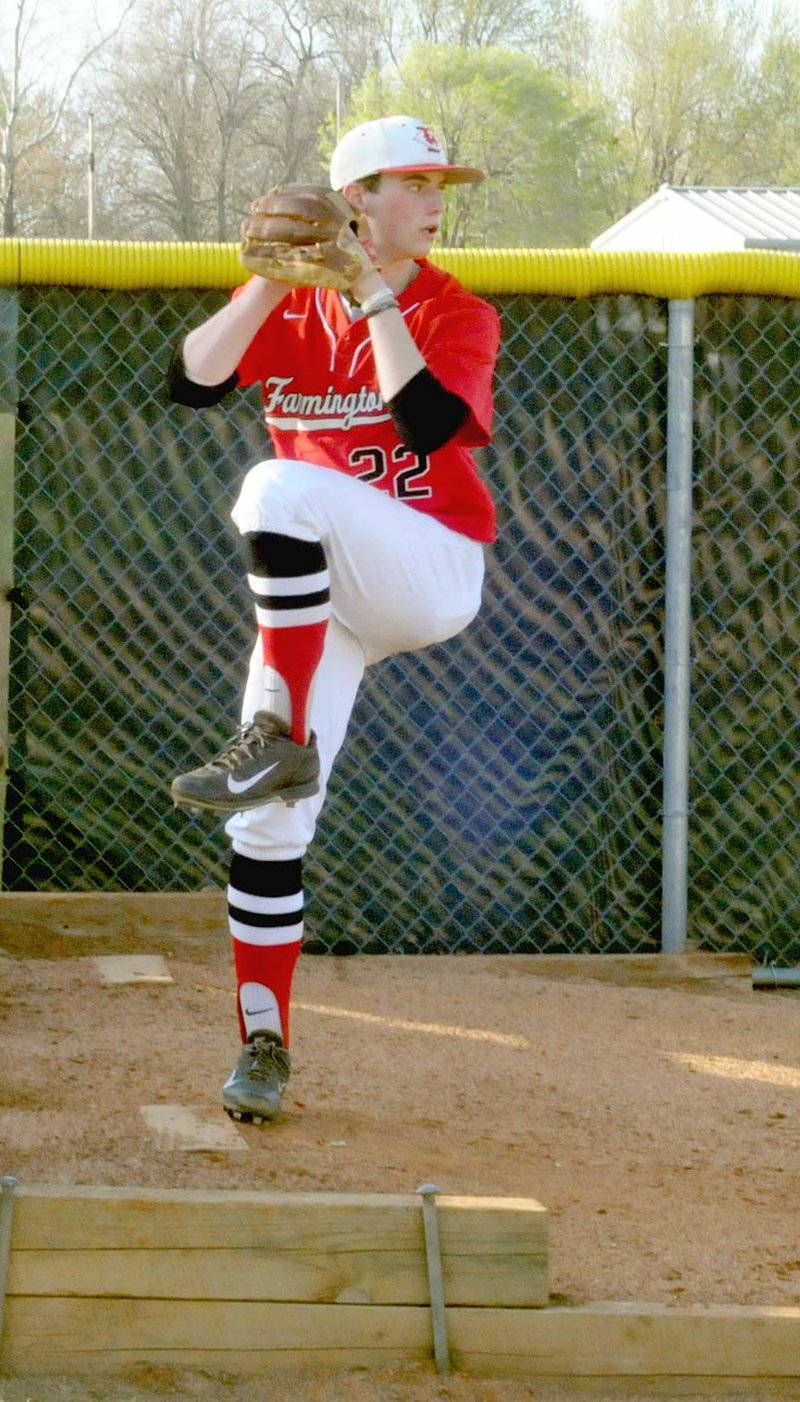 MARK HUMPHREY ENTERPRISE-LEADER Farmington freshman Tate Sutton warms up in the bullpen before pitching the fifth inning in the Cardinals' 13-0 win against Clarksville on Tuesday, April 17, 2018. Sutton faced four batters and struck out two, inducing a groundout to third to end the game.