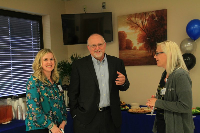 Photo by Steve Huckriede Jessica Bolin, Gravette Clinic administrator; Paul Taylor, Ozarks Community Hospital CEO; and Jackie Powell, OCH specialty clinic manager; wait in the lobby Thursday, April 12, to welcome guests to Ozarks Community Hospital's 10-year anniversary open house. Several area citizens came out to tour the hospital facilities and enjoy refreshments and door prizes.