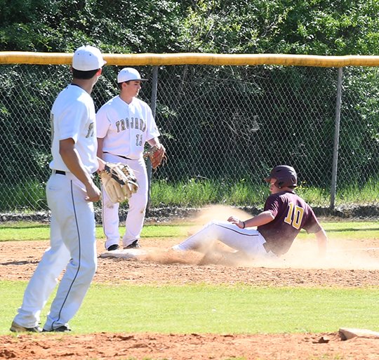 The Sentinel-Record/Grace Brown PERFECT 10: Lake Hamilton's Spencer Gracie (10) slides safely into third base as Hot Springs freshman Elias Parker (13) looks on during a baseball game Tuesday at Hot Springs. Gracie had one double, one walk, two RBIs and one run scored in Lake Hamilton's 12-0 win.
