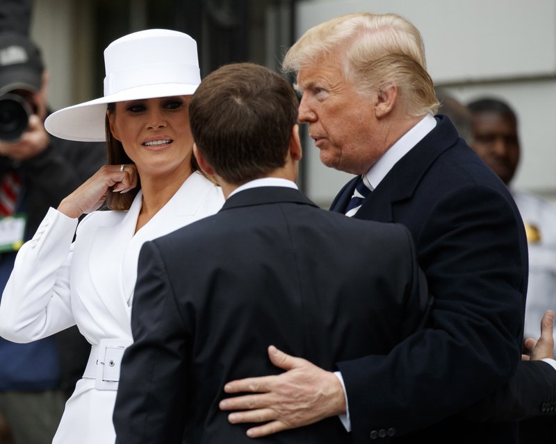 President Donald Trump and first lady Melania Trump greet French President Emmanuel Macron as he arrives for a State Arrival Ceremony on the South Lawn of the White House in Washington, Tuesday, April 24, 2018. (AP Photo/Carolyn Kaster)