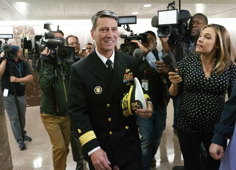 Rear Adm. Ronny Jackson, President Donald Trump's choice to be secretary of the Department of Veterans Affairs, leaves a Senate office building after meeting individually with some members of the committee that would vet him for the post, on Capitol Hill in Washington, Tuesday, April 24, 2018.  (AP Photo/J. Scott Applewhite)