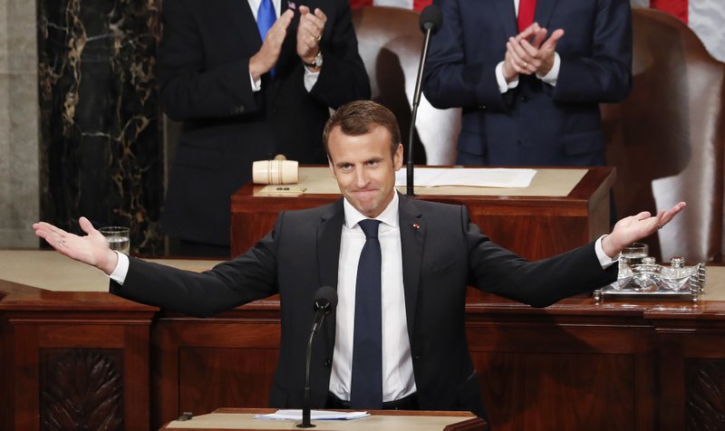 French President Emmanuel Macron gestures as he is introduced before speaking to a joint meeting of Congress on Capitol Hill in Washington, Wednesday, April 25, 2018.