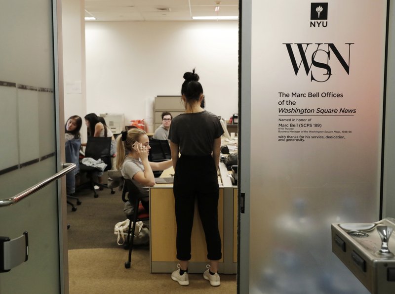 In this this, Sunday, April 22, 2018 photo, while pushing up against a deadline, students collaborate to put out the upcoming edition of the Washington Square News, New York University's independent, student-run, newspaper in New York. College journalists are speaking up for themselves in a coordinated campaign to combat some of the same forces that have battered newspapers across the country. More than 100 college newsrooms across the U.S., including the Washington Square News, are using social media campaigns, public awareness events and editorials Wednesday, April 25 to call attention to the important roles they play. 