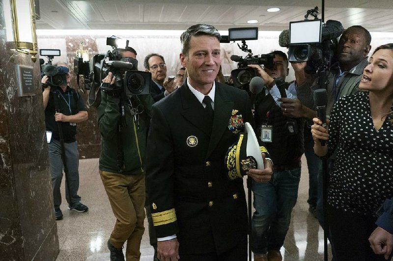 Rear Adm. Ronny Jackson, President Donald Trump's choice to be secretary of the Department of Veterans Affairs, leaves a Senate office building after meeting individually with some members of the committee that would vet him for the post, on Capitol Hill in Washington, Tuesday, April 24, 2018. 