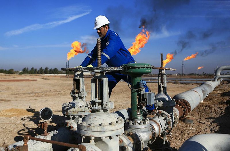 An Iraqi works in an oil field north of Basra. Oil revenue makes up nearly 95 percent of Iraq’s budget. 