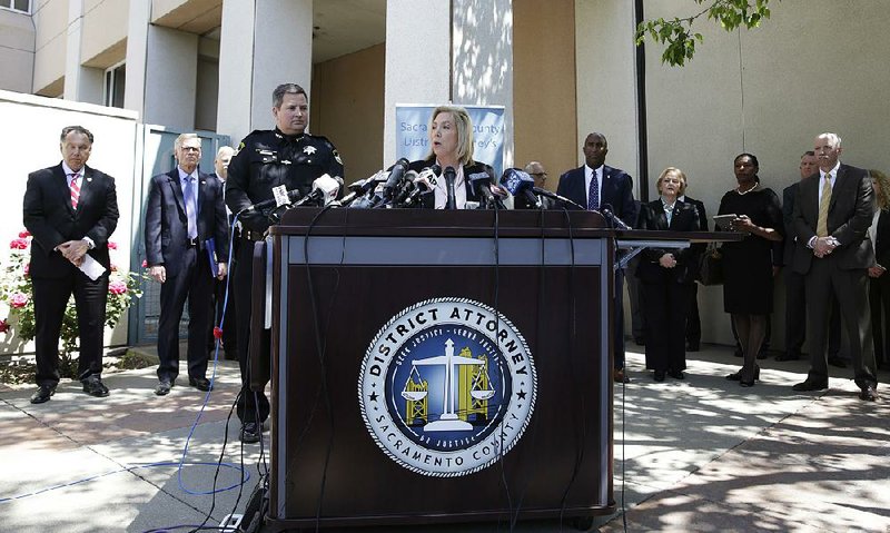 Sacramento County District Attorney Anne Marie Schubert, accompanied by law enforcement authorities from around the state, discusses Wednesday the arrest of a suspect in several violent crimes committed in the 1970s and 1980s.  