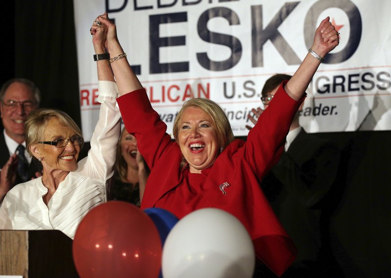 Republican U.S. Congressional candidate Debbie Lesko, right, celebrates her win with former Arizona Gov. Jan Brewer at her home, Tuesday, April 24, 2018, in Peoria, Ariz. Lesko ran against Democratic candidate Hiral Tipirneni for Arizona's 8th Congressional District seat being vacated by U.S. Rep. Trent Franks, R-Arizona. (AP Photo/Matt York)