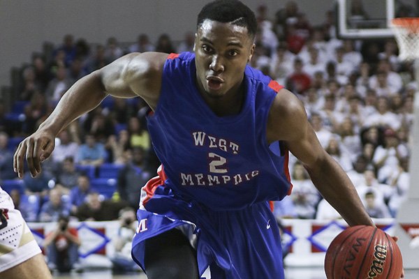 West Memphis forward Chris Moore (2) drives to the basket during the Boys 6A Basketball Championship Game against Jonesboro at Bank of the Ozarks Arena in Hot Springs on Saturday, March 10, 2018.
