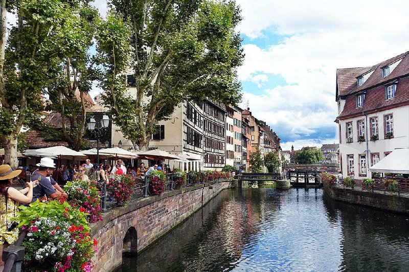 Strasbourg’s half-timbered buildings provide a Germanic backdrop for an Alsatian meal on this riverfront terrace.  
