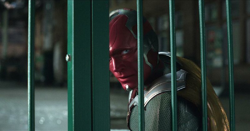 Vision, (Paul Bettany), was conceived as a bit of code written by Tony Stark and later uploaded into a robotic body. He’s now a socially awkward but endearing superhero with the ability to change his body density and one of the main characters in Avengers: Infinity War. 
