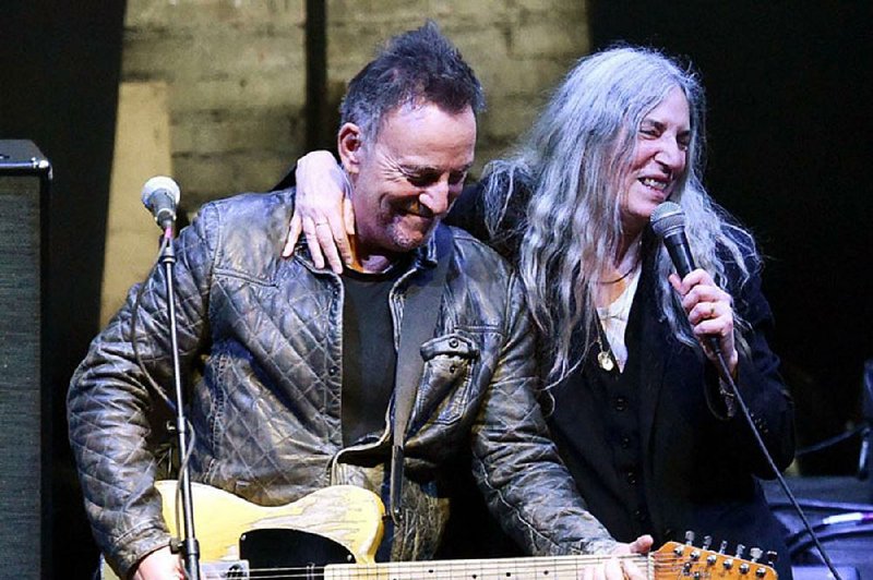 Bruce Springsteen joins Patti Smith on stage after a screening of Steven Sebring’s new concert film Horses: Patti Smith and Her Band at the Tribeca Film Festival Monday night. 

