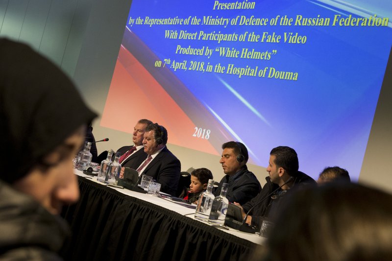 Syrians brought to The Hague by Russia in a move to discredit reports of an April 7, 2018, chemical weapons attack in the Syrian town of Douma appear at a press conference in The Hague, Netherlands, Thursday, April 26, 2018, after briefing members of the Organization for the Prohibition of Chemical Weapons, (OPCW). Russian diplomats claim the Syrians were used in staged videos made in the aftermath of the attack. (AP Photo/Peter Dejong)