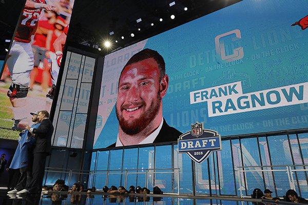 Commissioner Roger Goodell, left, poses with a fan after the Detroit Lions selected Frank Ragnow during the first round of the NFL football draft, Thursday, April 26, 2018, in Arlington, Texas. (AP Photo/David J. Phillip)

