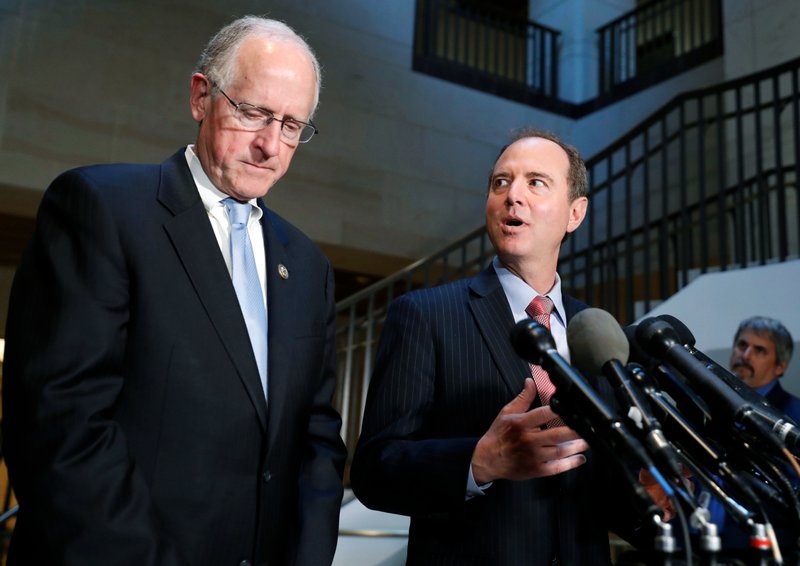 FILE - In this June 6, 2017, file photo Rep. Mike Conaway, R-Texas, left, a member of the House Intelligence Committee, and Rep. Adam Schiff, D-Calif., ranking member of the House Intelligence Committee speak after closed meeting in Washington. The Republican-led House intelligence committee on April 27, 2018, officially declared the end of its Russia probe, saying in its final report that it found no evidence that the Trump campaign colluded with Russia in the 2016 presidential campaign. (AP Photo/Alex Brandon, File)

