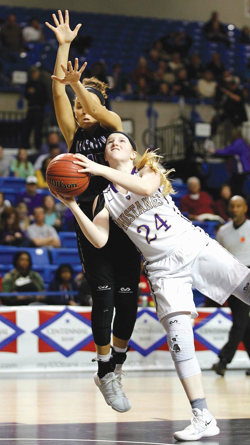 Central Arkansas Christian’s Bethany Dillard, right, goes up for a shot while being defended by Riverview’s Abbie Jiles  during the third quarter of the Mustangs’ 58-57 win in the Class 4A girls state-championship game on March 9 at Bank of the Ozarks Arena in Hot Springs. Jiles is this year’s Three Rivers Edition Girls Basketball Player of the Year.