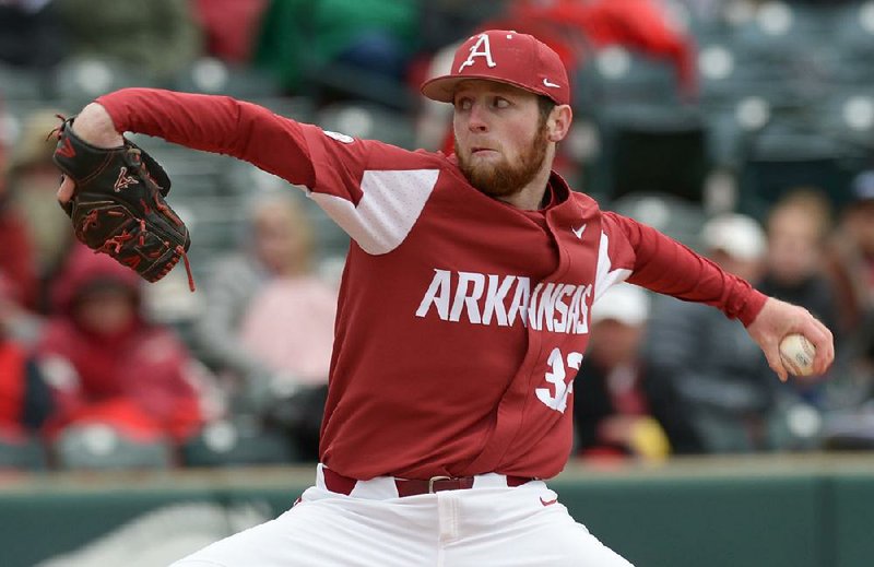 Arkansas closer Matt Cronin delivers to the plate against South Carolina Saturday, April 14, 2018, during the seventh inning at Baum Stadium. Visit nwadg.com/photos to see more photographs from the game.