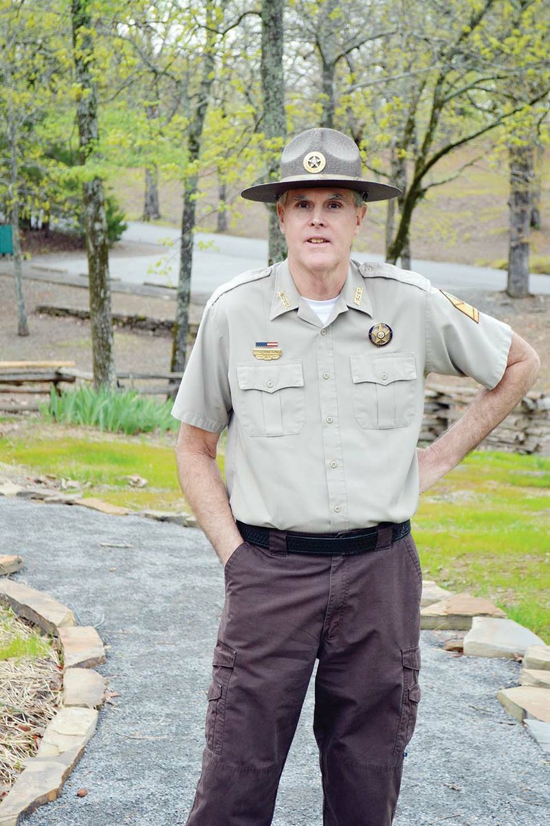 Woolly Hollow State Park Superintendent Steve Wilson stands on a path near the new visitor center, which was completed six weeks ago. Wilson said the facility was built with proceeds of a one-eighth-cent 
conservation tax, known as Amendment 75, approved in 1996. “That was the savior for state parks,” he said. Wilson will retire Monday after 39 years at the park. “You make a lot of friends with your repeat customers,” Wilson said.