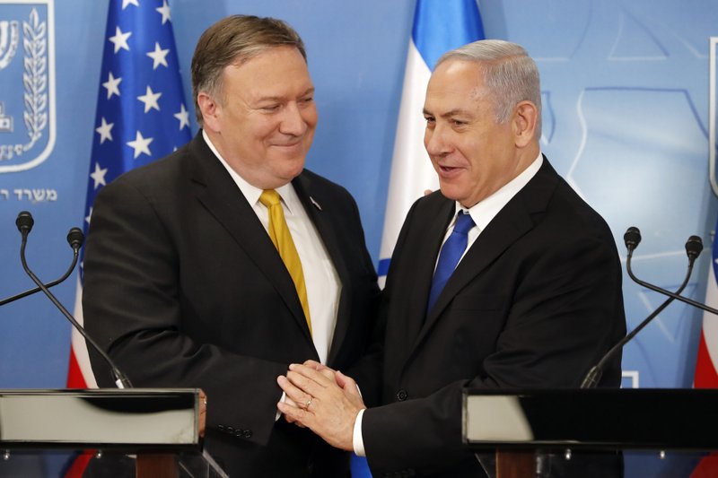 U.S. Secretary of State Mike Pompeo. left. is greeted by Israeli Prime Minister Benjamin Netanyahu ahead of a press conference at the Ministry of Defense in Tel Aviv, Sunday, April 29, 2018. (Thomas Coex, AFP via AP)