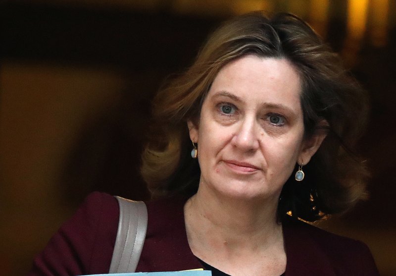 In this Wednesday, March 14, 2018 file photo Britain's Home Secretary Amber Rudd leaves 10 Downing Street in London. 