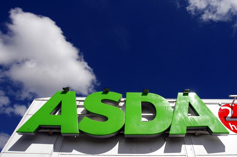 In this file photo dated Tuesday July 17, 2007, the sign of an Asda store in Wallington, England.  It is reported Monday April 30, 2018, Sainsbury's has agreed a merger deal with Walmart Inc.'s U.K. unit, Asda, for 7.3 billion pounds (dollars 10.1 billion U.S.) in cash and stock in a deal that would create Britain's largest supermarket chain, but the deal will be subject to review by Britain's Competition and Markets Authority. (AP Photo/Tom Hevezi, FILE)