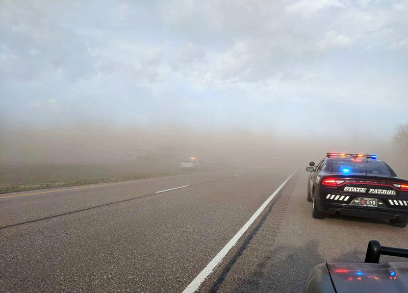 In this Sunday, April 29, 2018, photo provided by the Nebraska State Patrol, emergency personnel work at the scene of a multi-vehicle crash caused by blowing dust from farm fields along Interstate 80 near York, Neb. 