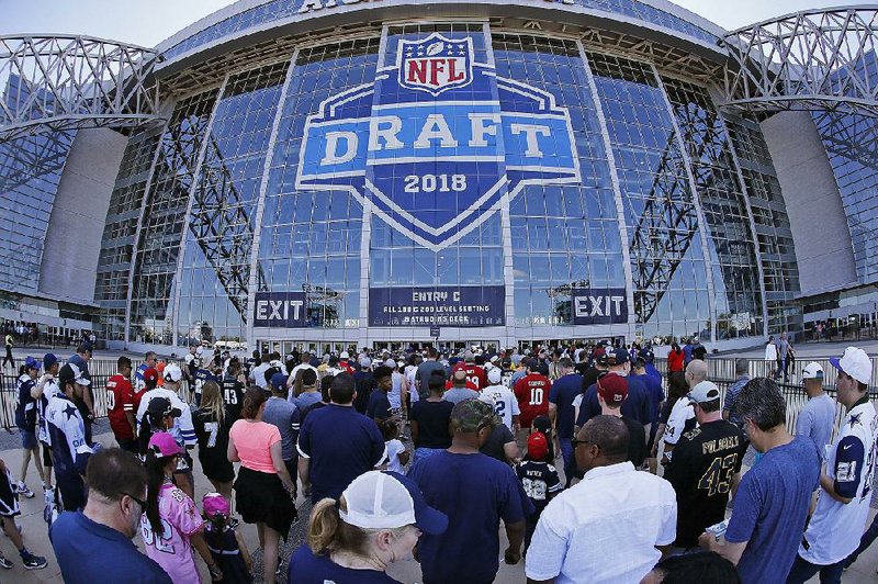 People wait to get into AT&T Stadium for the second round of the NFL Draft on Friday in Arlington, Texas. The Cowboys, who have ambitions of hosting another Super Bowl, showcased the draft without a hitch. 