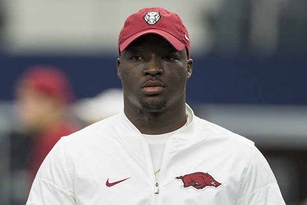 Former Arkansas running back Rawleigh Williams watches warmups prior to a game against Texas A&M on Saturday, Sept. 23, 2017, in Arlington, Texas. 