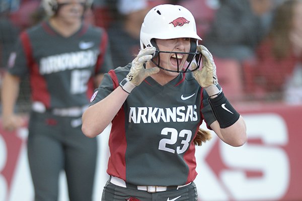 Arkansas Hannah McEwen celebrates after scoring a run Friday, March 30, 2018, during the fourth inning against Mississippi State at Bogle Park in Fayetteville.
