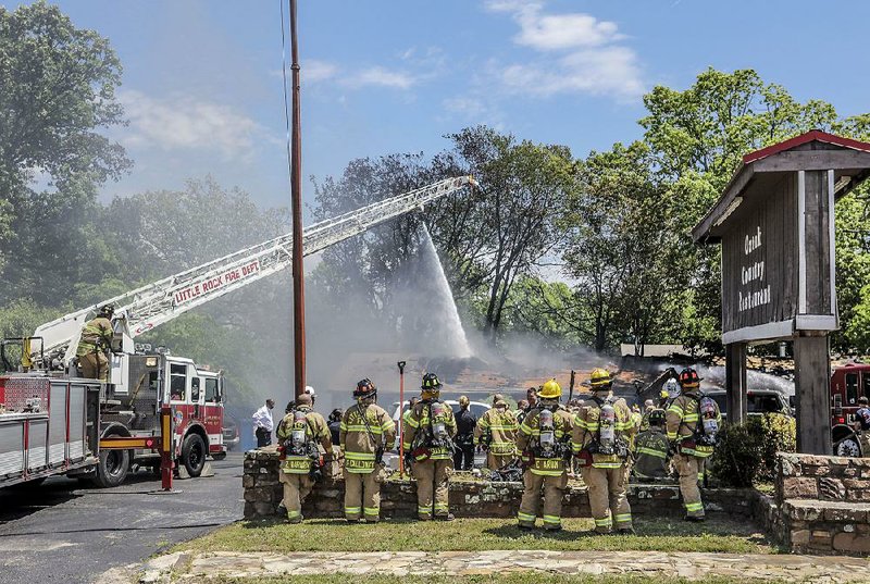 Flames spread quickly Tuesday afternoon at the Ozark Country Restaurant in Little Rock, a cook at the business said. 