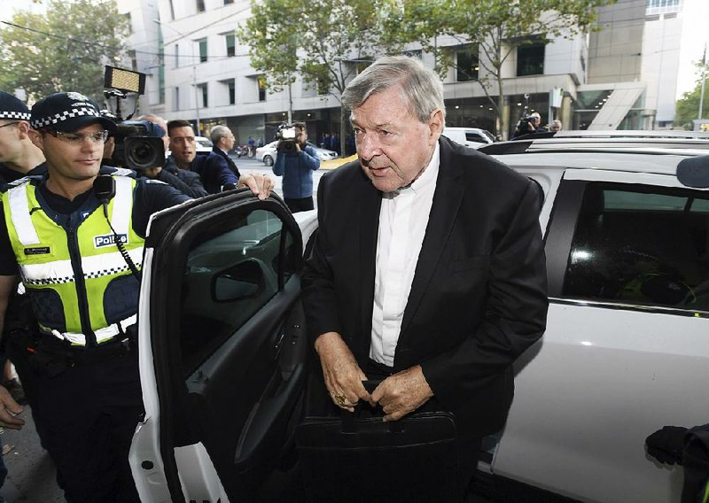 Australian Cardinal George Pell arrives at the courthouse Tuesday in Melbourne where he pleaded innocent in a sex-abuse case.  