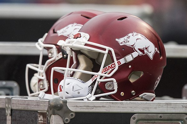 Arkansas football helmets sit atop storage bins during a game against Mississippi State on Saturday, Nov. 18, 2017, in Fayetteville. 