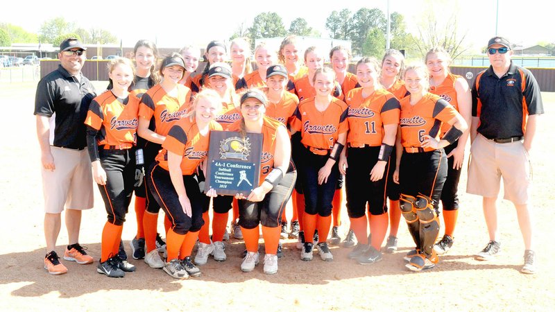 MARK HUMPHREY ENTERPRISE-LEADER/The Gravette softball team poses with their newly-won championship trophy. The Lady Lions won 5-0 over Pea Ridge in the District 4A-1 softball championship at Lincoln Saturday.