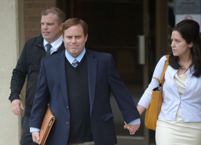 Former state Sen. Jon Woods walks out of the John Paul Hammerschmidt Federal Building in Fayetteville on Tuesday.