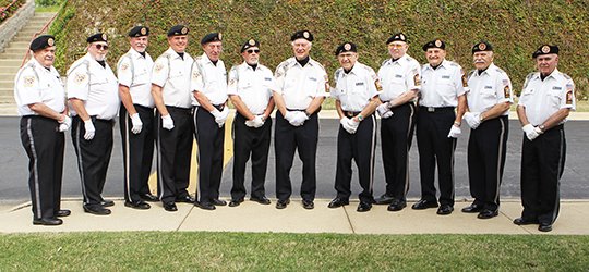 The Sentinel-Record/Richard Rasmussen HONOR GUARD: The dozen current members of the Veterans of Foreign Wars Post 2278 Honor Guard gathered Tuesday at the Garland County Library as the group is getting ready to resume the services they offer for funerals and other events after a temporary suspension of activities.