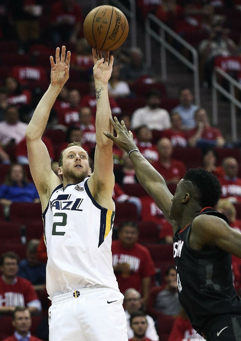 Utah Jazz forward Joe Ingles shoots over Houston Rockets center Clint Capela during Game 2 of their NBA playoff series Wednesday night. Ingles hit 7 of 9 three-pointers and led Utah with 27 points.  
