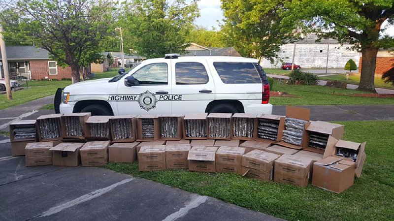 This photo, courtesy of the Arkansas Highway Police, shows the cache of marijuana and cannabis oil confiscated Monday from a truck at the Alma weigh station on Interstate 40.  