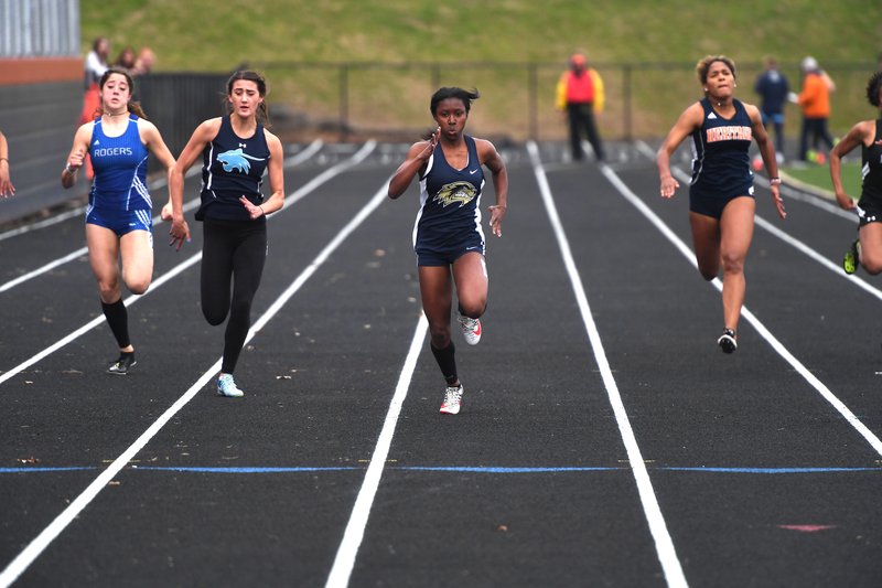 NWA Democrat-Gazette/J.T. WAMPLER Bentonville West's Grace Posey wins the 100 meter dash with a time of 12.09 Thursday April 26, 2018 at the 7A-West Conference track meet at War Eagle Stadium at Rogers Heritage High School. 