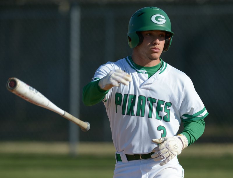 NWA Democrat-Gazette/ANDY SHUPE Greenland catcher Chandler Alaniz tosses the bat after drawing a walk against Smackover Saturday, March 24, 2018, during the first inning in the Jarren Sorters Memorial Tournament at A.J. Allen Park in Greenland. Visit nwadg.com/photos to see more photographs from the game.