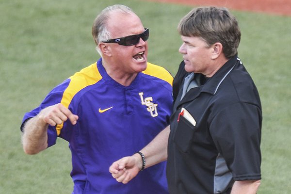 LSU head coach Paul Mainieri, left, is ejected by home plate umpire Morris Hodges during the ninth inning against Mississippi during an NCAA college baseball game in Oxford, Miss., Saturday, April 28, 2018. (Bruce Newman/The Oxford Eagle via AP)

