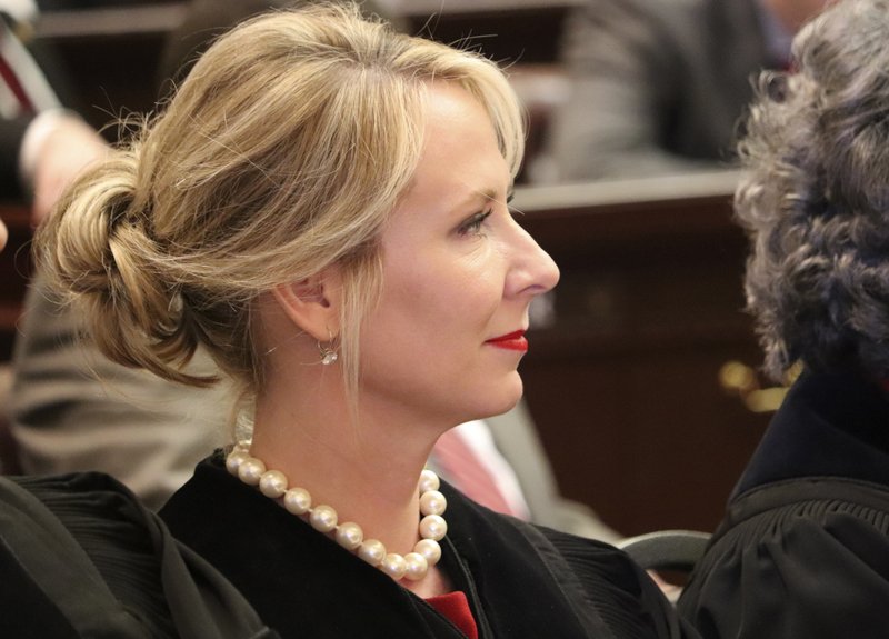 In this Feb. 12, 2018 file photo, Arkansas Supreme Court Justice Courtney Goodson sits inside the House chamber while waiting on Gov. Asa Hutchinson to deliver his State of the State address in Little Rock. (AP Photo/Kelly P. Kissel)