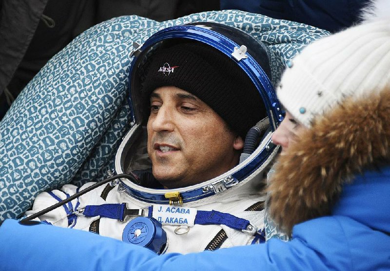  Astronaut Joseph Acaba rests Feb. 28 near the Kazakh town of Zhezkazgan after returning to Earth from the space station. 