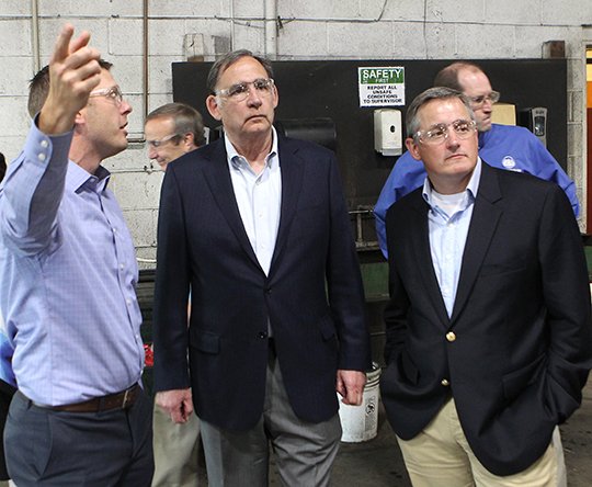 The Sentinel-Record/Richard Rasmussen ON THE FACTORY FLOOR: Timber Automation President John Steck, left, explains the company's production process Thursday at the Forest Products Technology Center to U.S. Sen. John Boozman, R-Ark., and U.S. Rep. Bruce Westerman, R-District 4.