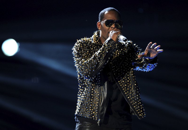 In this June 30, 2013, file photo, R. Kelly performs onstage at the BET Awards at the Nokia Theatre in Los Angeles. R. Kelly says the media are attempting to distort and destroy his legacy by reporting allegations that he sexually mistreats women. The R&B artist says in a statement Friday, May 4, 2018 that he's "heartbroken" by the accusations.