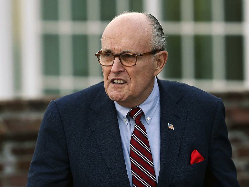 In this Nov. 20, 2016 file photo, former New York Mayor Rudy Giuliani arrives at the Trump National Golf Club Bedminster clubhouse in Bedminster, N.J. 