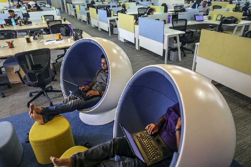 Employees work at the Flipkart Online Services headquarters in Bengaluru, India, in this file photo. Flipkart is the the No. 1 ecommerce operator in India.  
