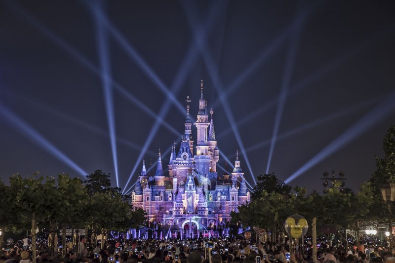 Lights are displayed outside the Enchanted Storybook Castle during the one-year celebration of Walt Disney Co. Shanghai Disneyland resort at the theme park in Shanghai, China, on June 16, 2017. 