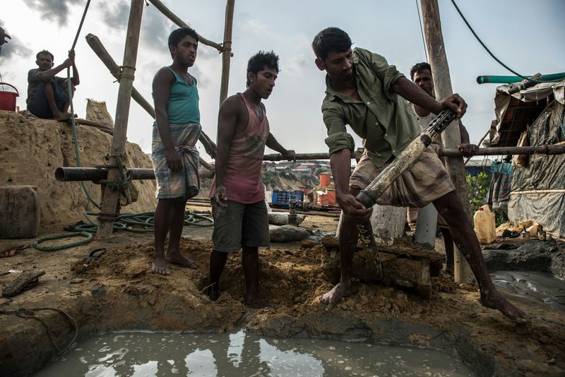 Workers dig a new well on April 21 on a hilltop in the Balukhali camp in preparation for the June monsoon season. Low-lying water sources are expected to be contaminated in the event of floods. 