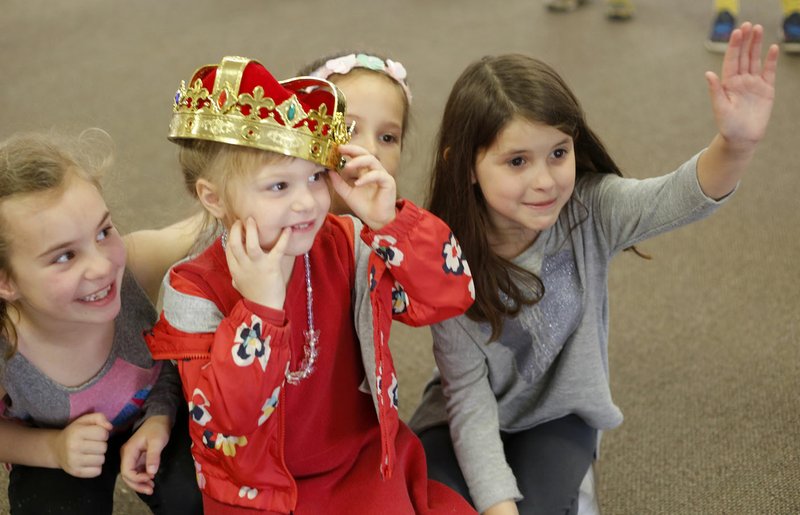 NWA Democrat-Gazette/DAVID GOTTSCHALK Stella Sarna (center), 4, sits on a throne created by Anna Jackson (from left), 7, Kyle Campbell, 7, and Rosalynd Wear, 7, Wednesday, March 21, 2018, in the play production with TheareSquared of The Case of the Missing Crown during Camp Sequoyah - Spring Break 2018 at Mount Sequoyah in Fayetteville. The three day camp offered sessions in Food and Fitness, Art and Drama and Sport and Outdoor.